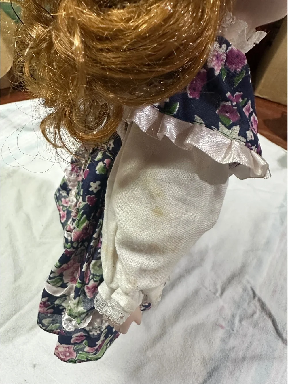 Vintage Porcelain Doll with Floral Dress and Curly Red Hair